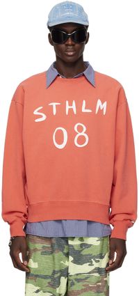Acne Studios Pull orange à écussons graphiques