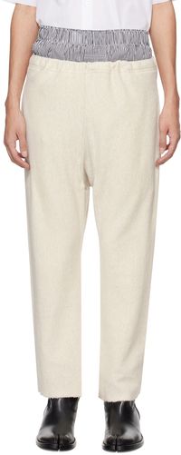 Maison Margiela Pantalon de survêtement blanc cassé à bords bruts