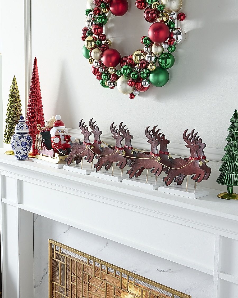 Santa On His Sled & Reindeer Nutcracker Decoration