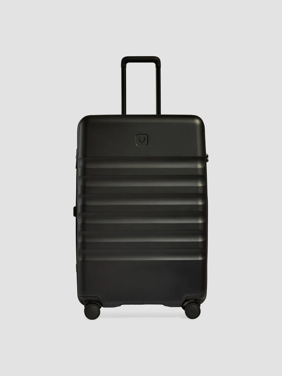 Icon Stripe Expandable Hardshell Spin Suitcase - Black