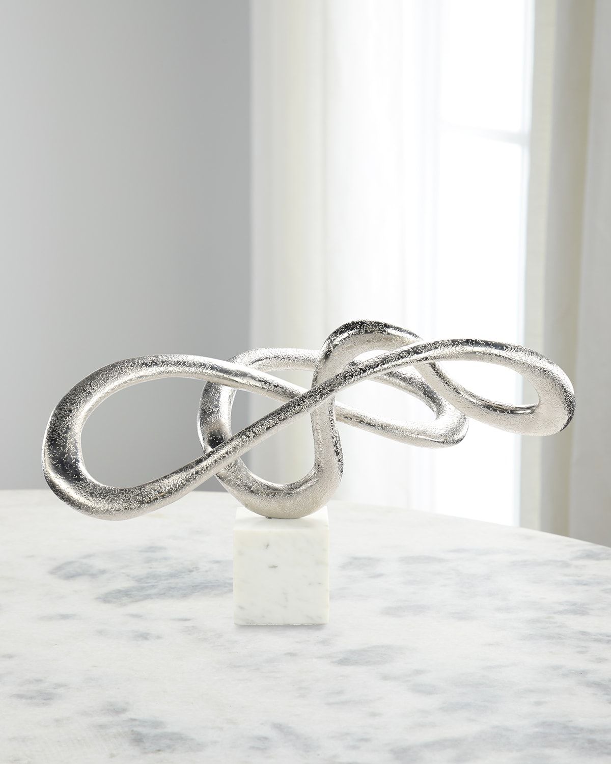 Serpentine Sculpture on Marble