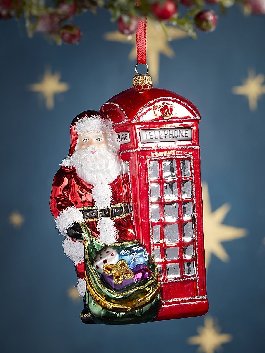 Santa Leaning Out Of The Phone Booth Glass Ornament