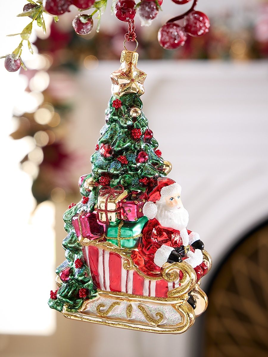Santa In Sleigh By The Tree Glass Ornament
