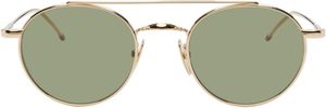 Thom Browne Lunettes de soleil rondes dorées en titane