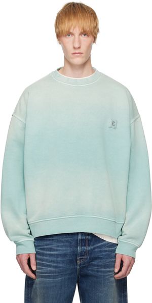 WOOYOUNGMI Pull molletonné bleu à effet délavé et à logo à l'arrière