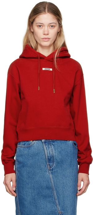 JACQUEMUS Pull à capuche rouge à écusson en gros-grain - La casa