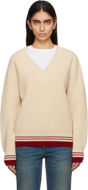 AMI Paris Pull beige en tricot côtelé de laine à col en V