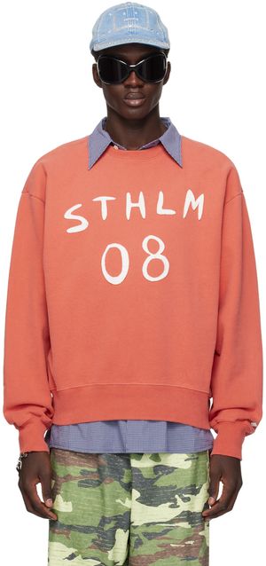 Acne Studios Pull orange à écussons graphiques